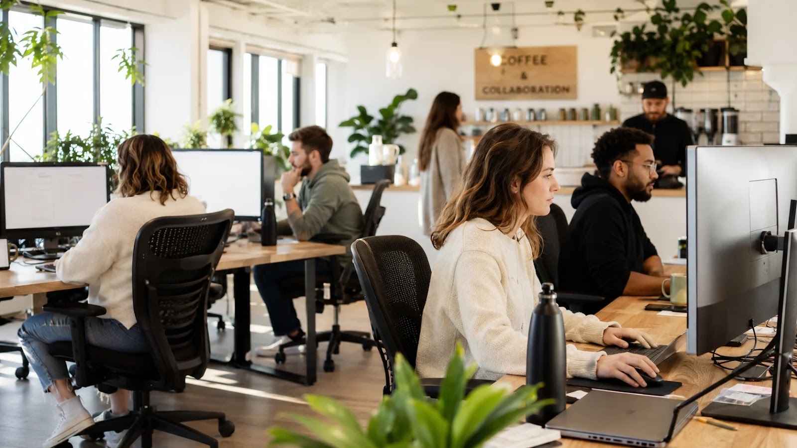 People working in the modern makerSP_CE coworking space – shared work environment