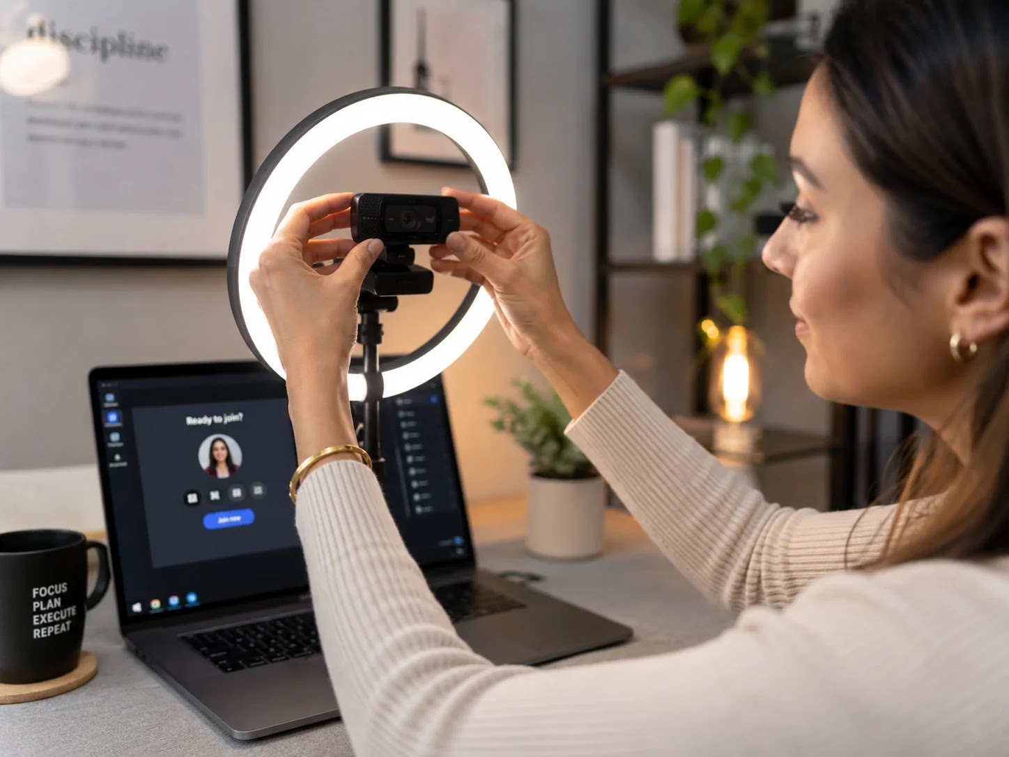 A laptop raised on a stand for the camera at eye level