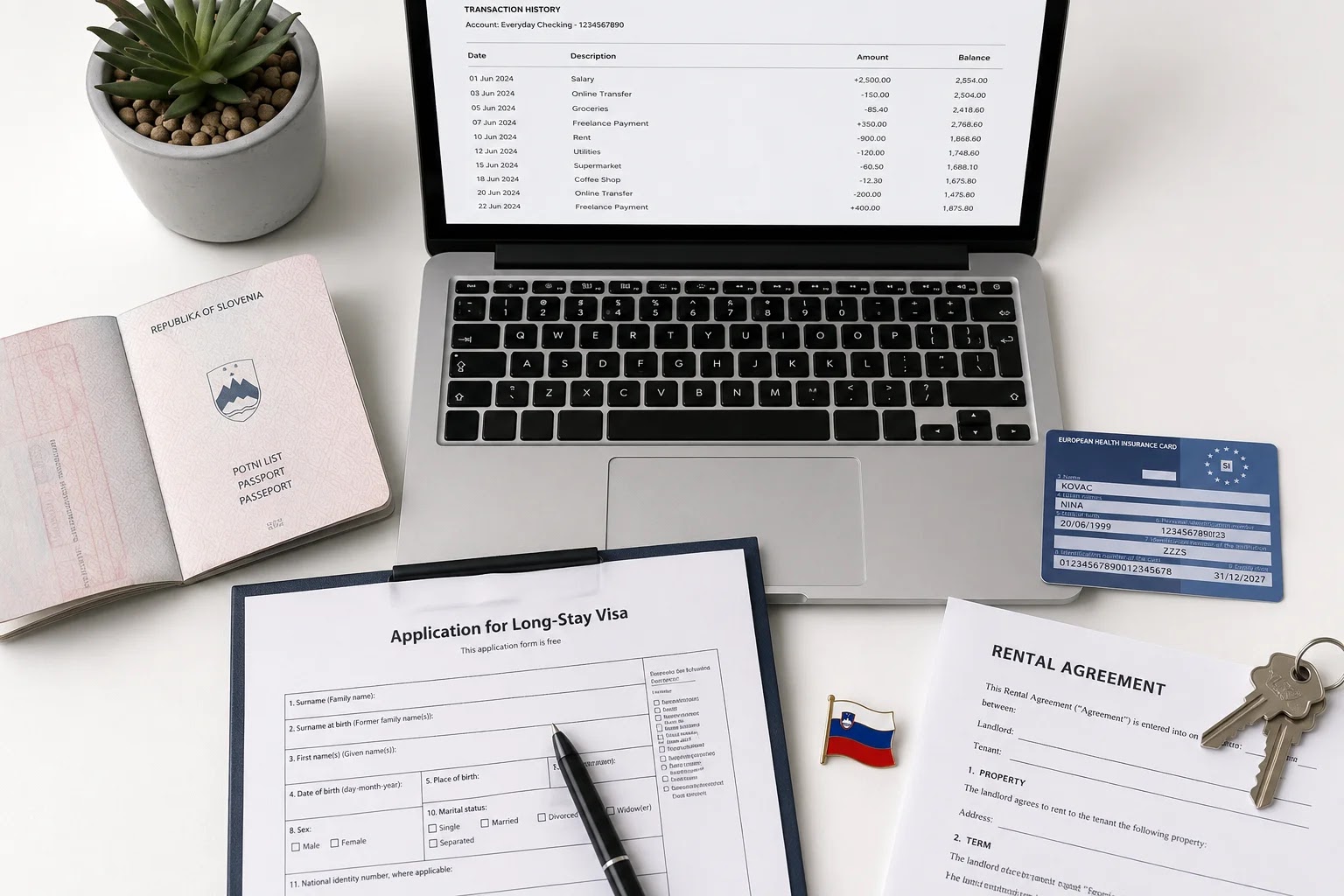 Laptop, passport and residence permit application documents laid out on a desk
