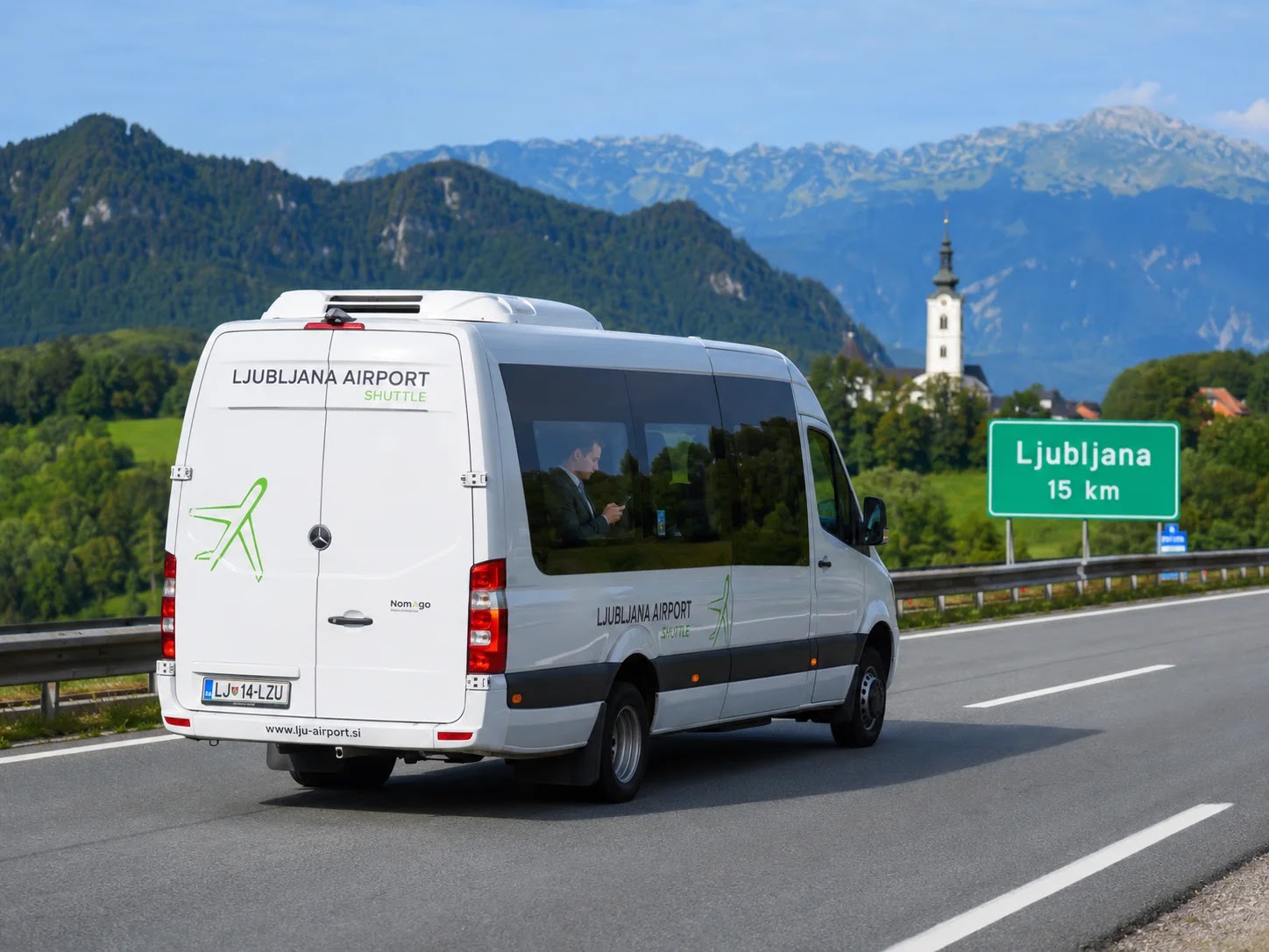 Airport shuttle on the motorway from Ljubljana Airport to the city