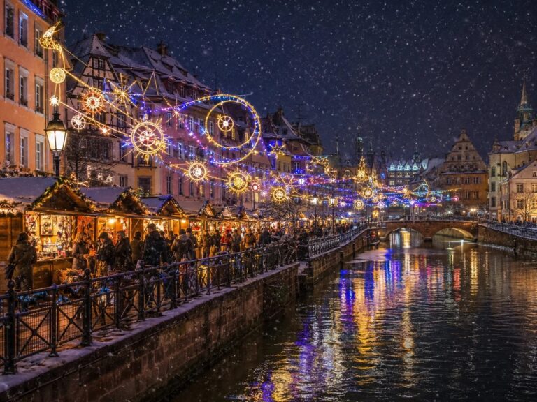 Festive holiday lights along the Ljubljanica river in winter