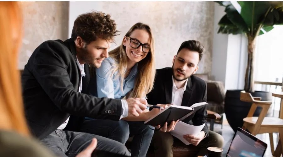Startup entrepreneurs collaborating and staying motivated